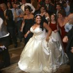 A bride and groom dancing on the dance floor.