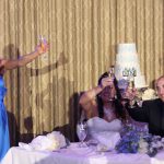 A bride and groom toasting champagne at a wedding reception.