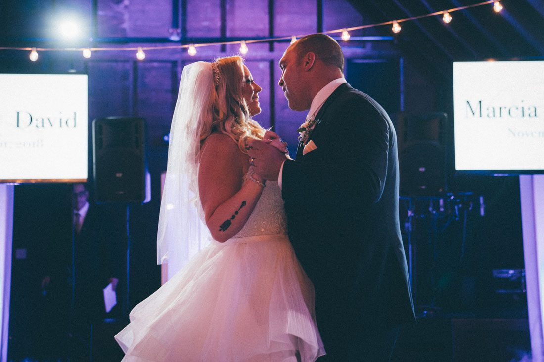 A Perona Farms bride and groom sharing their first dance at their wedding reception.