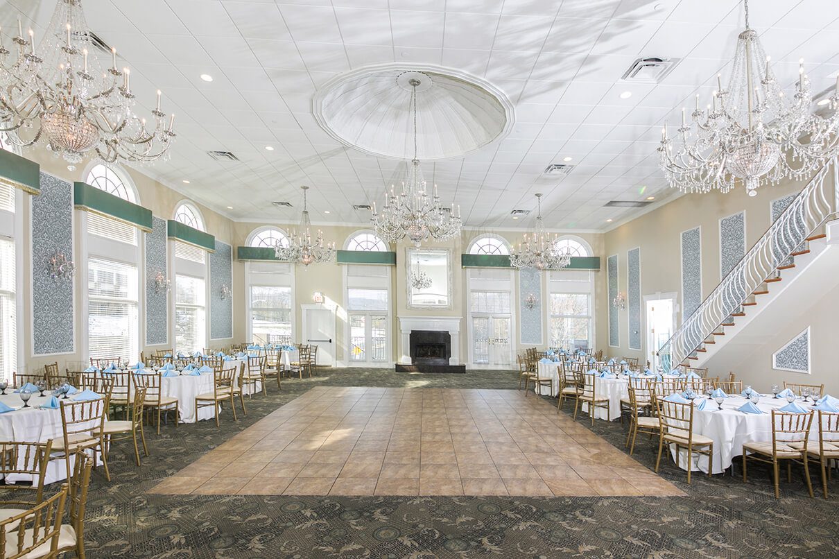 Elegant ballroom with chandeliers and dance floor.